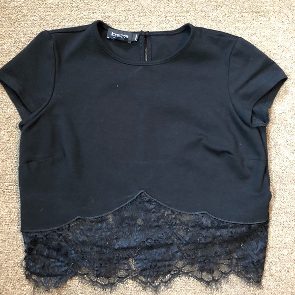 bebe Tops - A black crop top with lace on the bottom